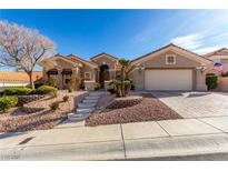 Charming single-story home featuring a manicured front yard and attached garage at 10709 Brinkwood Ave, Las Vegas, NV 89134