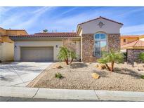 Charming home with stone accents, desert landscaping, and a two-car garage at 1223 Casa Palermo Cir, Henderson, NV 89011