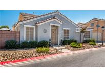 Charming single-story home with neutral color palette, desert landscaping, and covered entry at 2510 Influential Ct, North Las Vegas, NV 89031