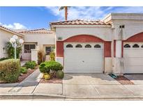 Charming home featuring a terracotta-tiled roof, stucco exterior, and a well-manicured front yard with desert landscaping at 5185 Briar Meadow Way, Las Vegas, NV 89118