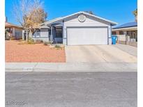 Charming single-story home featuring a well-maintained front yard and a two-car garage at 7436 Lattimore Dr, Las Vegas, NV 89128