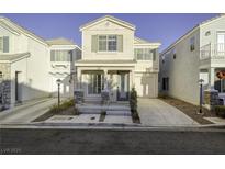 Charming two-story home with neutral siding, shuttered windows, and a well-maintained front yard at 8234 Misty Sage St, Las Vegas, NV 89139