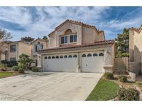 Charming two-story home with a three-car garage and a well-maintained front yard, creating curb appeal at 23 Antero Dr, Henderson, NV 89074