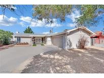 Charming single-story home featuring a spacious driveway and attached two-car garage at 3800 San Joaquin Ave, Las Vegas, NV 89102