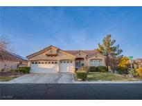 Charming single-story home featuring a well-manicured front yard and a spacious three-car garage at 3882 Genoa Dr, Las Vegas, NV 89141