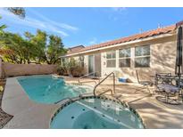 Backyard view with private pool and patio for outdoor entertainment, perfect for relaxation and leisure at 5873 Wildhorse Ledge Ave, Las Vegas, NV 89131