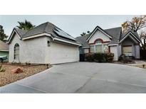 Charming single-story home with a well-maintained front yard and a two-car garage at 6545 Bradford Ln, Las Vegas, NV 89108