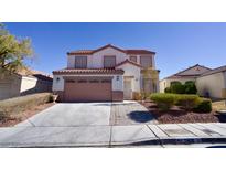 Charming two-story home with a well-manicured lawn and a two-car garage at 7808 Wavering Pine Dr, Las Vegas, NV 89143