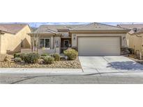 Charming single-story home with a two-car garage and low maintenance desert landscaping at 7828 Homing Pigeon St, North Las Vegas, NV 89084