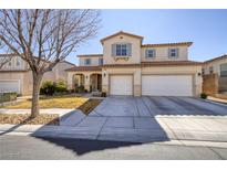 Charming two-story home featuring a stucco exterior, tile roof, three car garage and well-maintained landscaping at 9379 Arrowhead Bluff Ave, Las Vegas, NV 89149