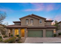 Charming two-story home features a tiled roof, neutral stucco, and a three-car garage at 12135 Kite Hill Ln, Las Vegas, NV 89138