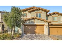 Charming two-story home with a two-car garage and well-maintained landscaping at 310 Silva Pl, Henderson, NV 89011