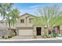 Charming two-story home featuring a well-manicured front yard and attached two-car garage at 376 Shanon Springs St, Henderson, NV 89014