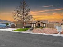 Charming single-story home with desert landscaping and a covered entryway at 6627 Bristle Canyon Ave, Las Vegas, NV 89110