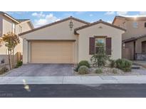 Charming single-story home with a brick driveway and manicured landscaping at 8876 Trotternish Ridge Dr, Las Vegas, NV 89166
