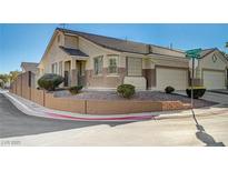 Inviting single-story home boasting a well-maintained front yard and a convenient attached two-car garage at 9271 Mandeville Bay Ave, Las Vegas, NV 89148
