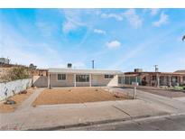 Charming single-story home with a well-kept yard, and covered entrance at 1216 Oahu St, Las Vegas, NV 89104