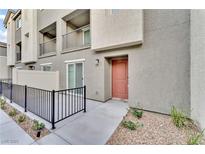 Beautiful townhouse showcasing neutral paint, metal railings, and a private patio at 12305 Crimson Horizon Rd # 4, Las Vegas, NV 89183