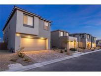 Modern two-story home featuring a two-car garage and desert landscaping at 1592 Pacific Baza St, Las Vegas, NV 89138