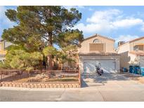 Charming two-story home with a well-manicured front yard and a convenient two-car garage at 2245 Saint Paul Way, Las Vegas, NV 89104