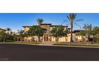 Striking two-story home with desert landscaping, stone accents, and a three-car garage at 34 Vintage Canyon St, Las Vegas, NV 89141