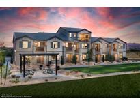 Beautiful two-story home with balconies, green lawn, and picnic area, perfect for outdoor living and entertaining at 640 Bellus Pl # Lot 178, Henderson, NV 89015