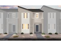 A modern home featuring a two-story design with a private balcony and neutral color scheme at 6668 Nimbus Ave # Lot 22, Las Vegas, NV 89130