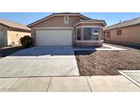 Charming single-story home with a two-car garage and bay window at 7896 Muldrow St, Las Vegas, NV 89139