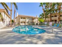 Relaxing community pool with spa and lounge chairs for residents at 1201 Sulphur Springs Ln # 101, Las Vegas, NV 89128