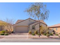 Charming single-story home with a brick driveway and a well-maintained front yard on a sunny day at 472 Cadence View Way, Henderson, NV 89011
