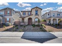 Charming two-story home featuring desert landscaping and neutral color palette at 3757 Via Gennaro, Henderson, NV 89044