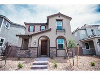 Charming two-story home with stone accents, neutral colors, and a well-maintained front yard at 3757 Via Gennaro, Henderson, NV 89044