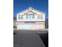 Three-story home featuring three garage spaces and multiple windows for natural light at 6380 Extreme Shear Ave # 102, Henderson, NV 89011