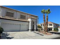 Charming two-story home with a spacious three car garage, desert landscaping and tile roof at 8500 Copper Mountain Ave, Las Vegas, NV 89129