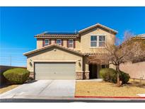 Charming two-story home featuring a two-car garage, well-maintained landscaping, and solar panels on the roof at 10355 Sipple St, Las Vegas, NV 89141