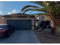 Charming single-story home with a two-car garage and desert landscaping for low maintenance at 2227 Garden City Ave, Henderson, NV 89052