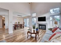 Inviting living room boasts wood floors, fireplace, and ample natural light at 2504 Cove Rd, Las Vegas, NV 89128