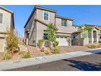 Charming two-story home with landscaped yard, brick-paved driveway, and well-maintained exterior in a desirable neighborhood at 26 Lilla Rosa St, Henderson, NV 89011