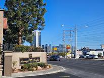 View of Flamingo Heights sign with street traffic and Las Vegas skyline in the background at 4055 Nook Way # A, Las Vegas, NV 89103