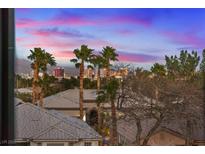 Beautiful view featuring palm trees and rooftops, capturing the essence of luxury living and neighborhood charm at 4288 Veraz St, Las Vegas, NV 89135