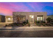 Charming single-story home with modern brickwork, landscaped yard, and gated front entrance at 472 Sand Dune Arch St, Las Vegas, NV 89138