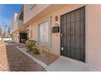 Charming townhome featuring desert landscaping, a secure gated entry, and a private mailbox at 5939 Vegas Dr, Las Vegas, NV 89108