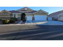 Charming single-story home with a two-car garage and a beautifully landscaped front yard at 8301 Mooses Ct, Las Vegas, NV 89131