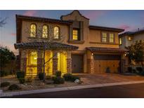 Charming two-story home boasts a three-car garage, well-manicured landscaping, and beautiful architectural details at 12279 Lost Treasure Ave, Las Vegas, NV 89138