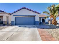 Charming single-story home with a well-maintained front yard, driveway, and two car garage at 2345 Steinke Ln, Las Vegas, NV 89108