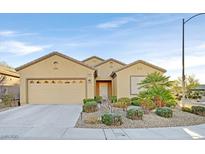 Charming single-story home featuring a well-manicured front yard and a two-car garage at 2405 Gamma Ray Pl, Henderson, NV 89044