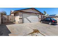 Charming single-story home with a two-car garage and long driveway on a sunny day at 2712 Rialto Rd, Las Vegas, NV 89108