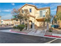 Two-story home featuring neutral siding, two-car garage, balcony, and low-maintenance landscaping at 4228 Hickman Ct, Las Vegas, NV 89129