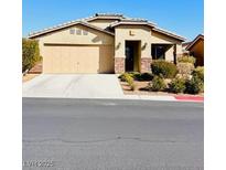 Charming single story home with a two car garage and low maintenance landscaping at 4562 White Cap Mill St, Las Vegas, NV 89147