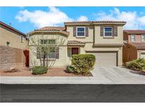 Charming two-story home with tile roof, neutral siding, and a well-maintained front yard at 5976 Ancona Dr, Las Vegas, NV 89141